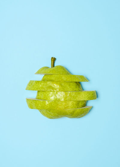 Close-up of apple against blue background
