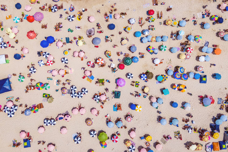 Aerial view of people enjoying on beach