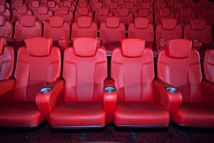 Empty red chairs at theater