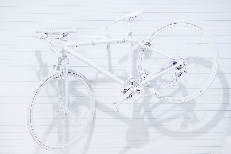 High angle view of bicycle on white wall