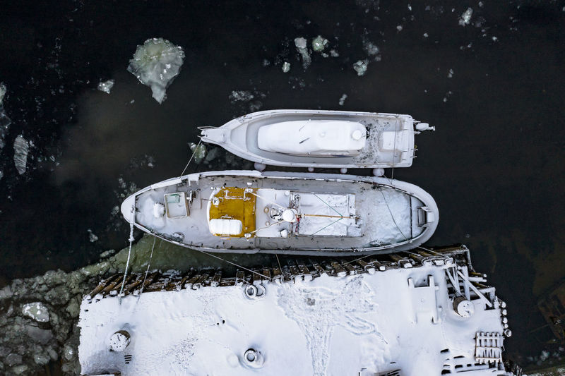 High angle view of abandoned car on field during winter