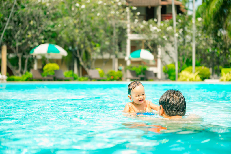 Boy swimming in pool