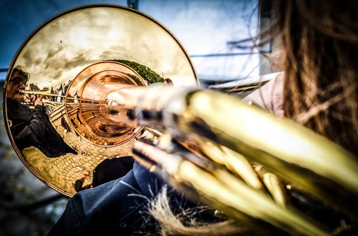 Reflection of musician on trumpet