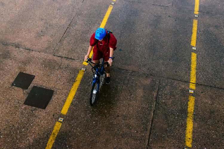 High angle view of man bicycling on road