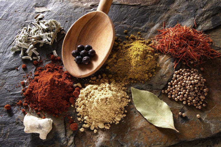 High angel view of spices on stone background