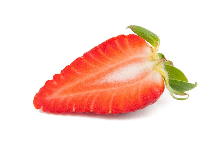 Close-up of strawberry against white background