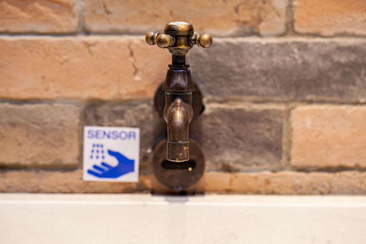 Close-up of trophy on brick wall