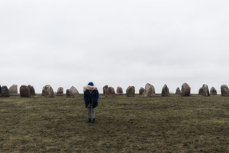 Tourist at ale's stones in skåne, sweden