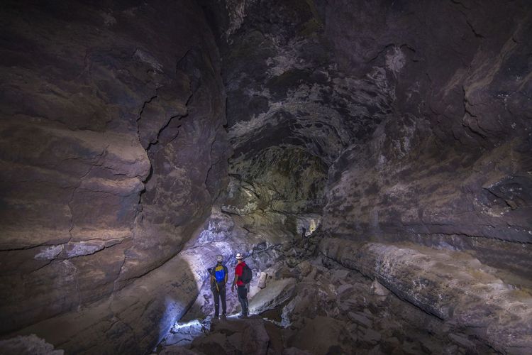 People walking in cave