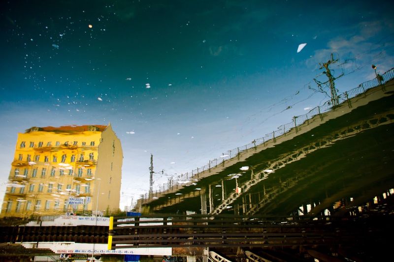 View of bridge and buildings against sky