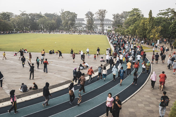 Bandung the most athletic city in the world. stunning view of an athletic field full of people. 