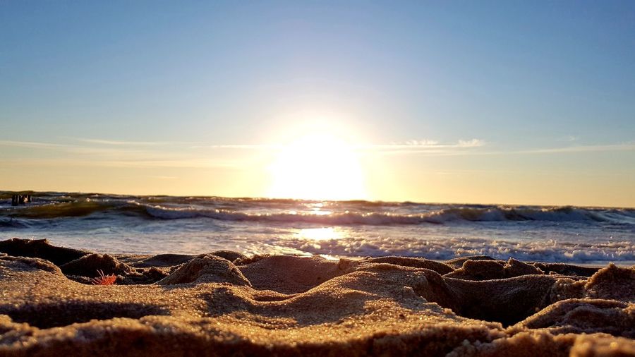 Scenic view of sea against sky at sunset