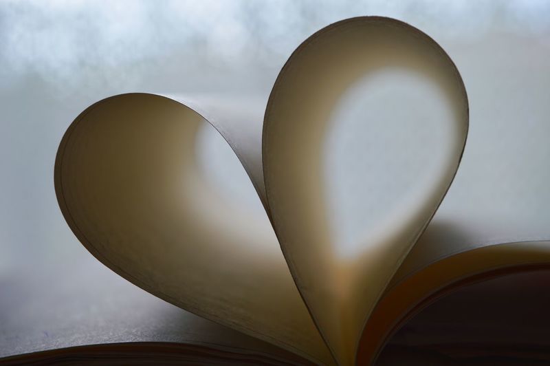 Heart shape made of papers in book