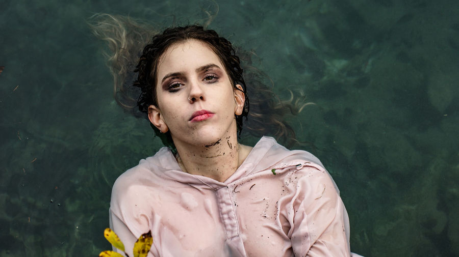 Portrait of young woman in swimming lake