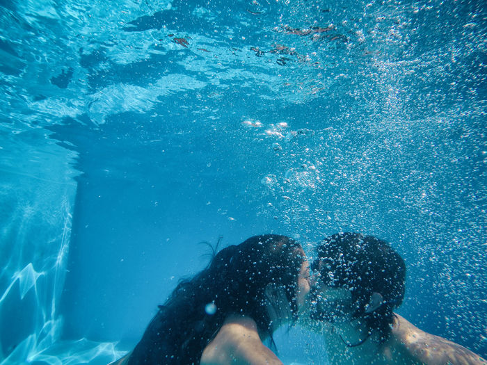 Couple kissing in swimming pool