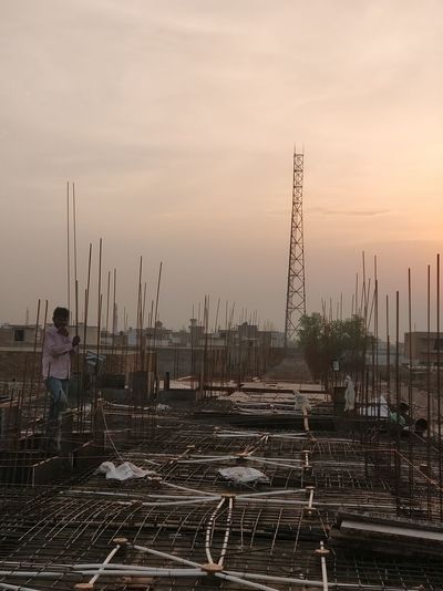 View of construction site against sky during sunset