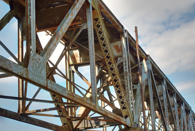 Low angle view of metallic structure against sky