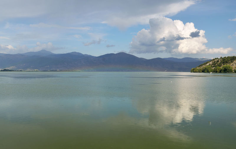 Landscape with rainbow over the lake