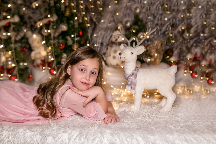 Portrait of girl with christmas tree