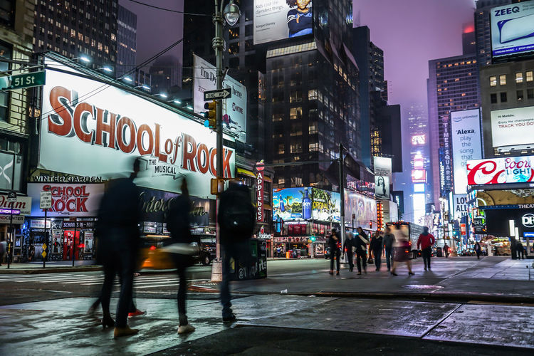 People walking on street in city