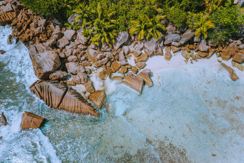 Aerial view of rocks at beach in island