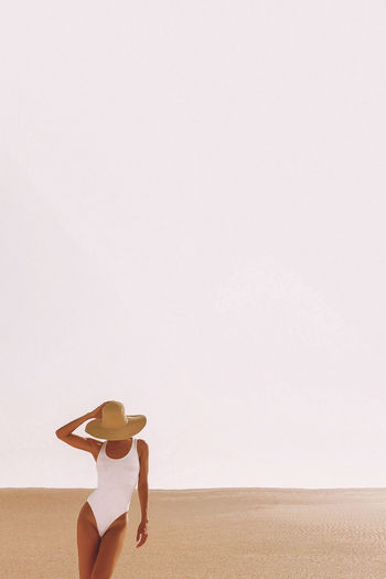 Beach lady. minimal desert landscape. vacation vibes
