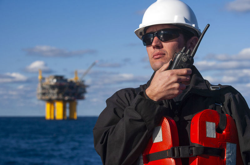 Offshore energy production with person on ship