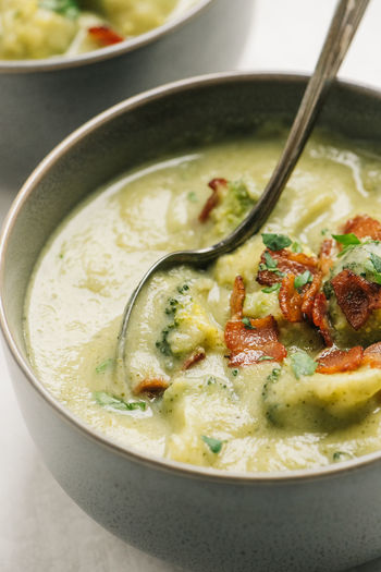 Closeup of potato and broccoli soup with bacon