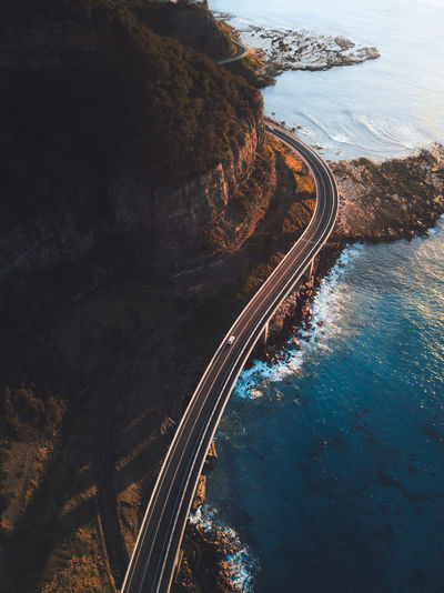 High angle view of railroad tracks by sea