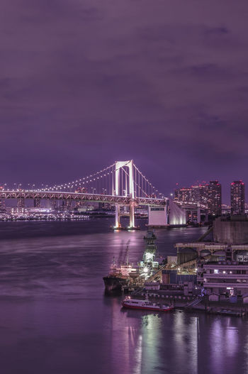 Circular highway leading to the rainbow bridge in odaiba bay of tokyo.