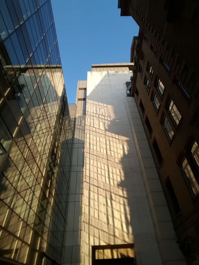 Low angle view of skyscrapers against clear sky