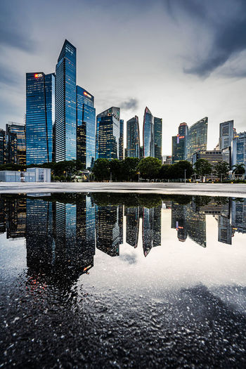 Reflection of illuminated buildings in city