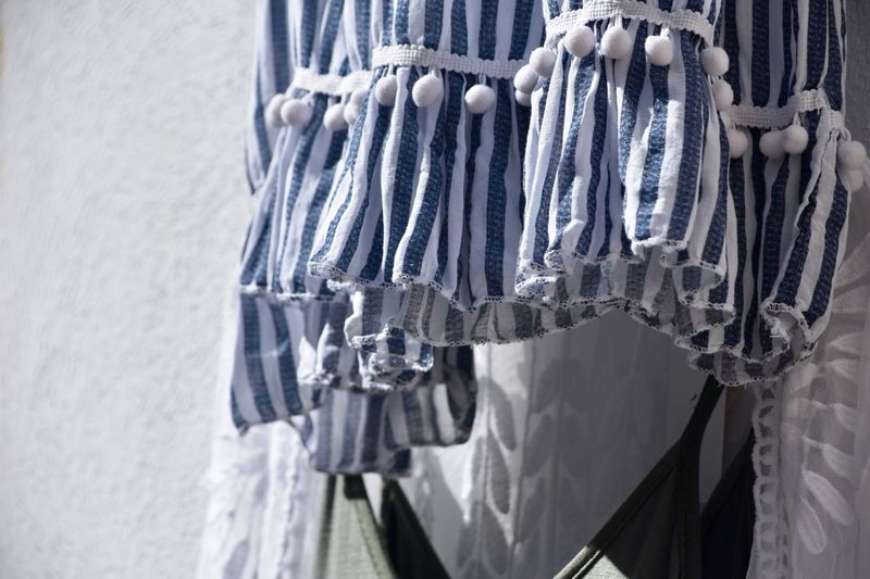 Close-up of clothes hanging on wall