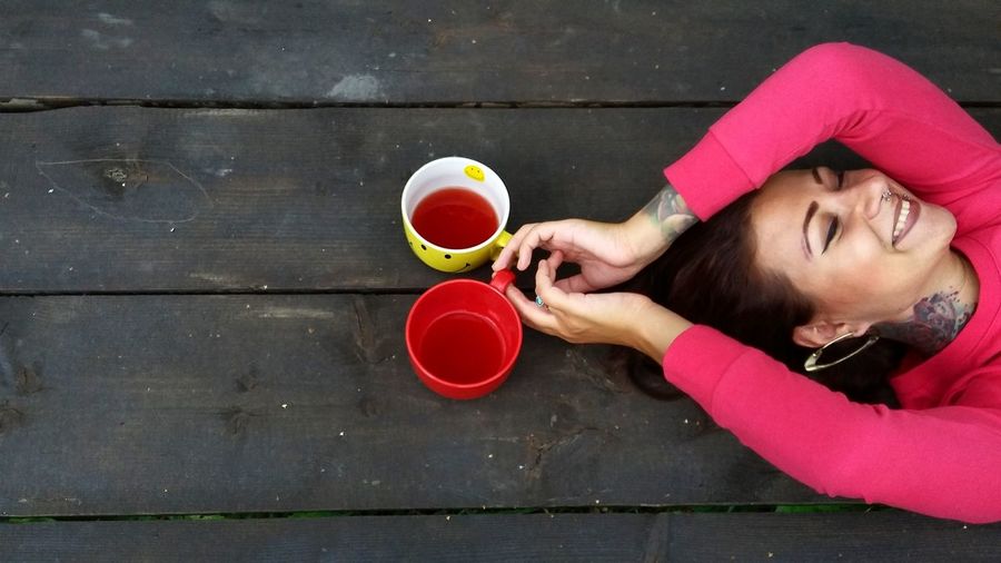 Woman holding mugs