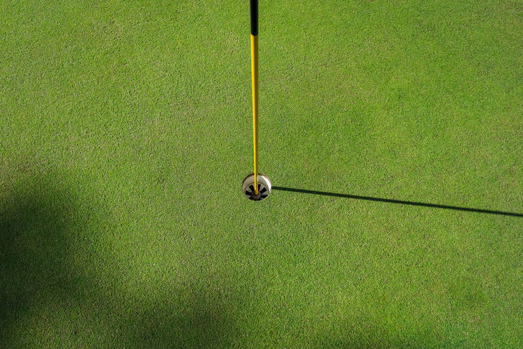 High angle view of golf ball on field