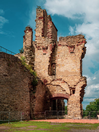 Low angle view of old ruin building against sky