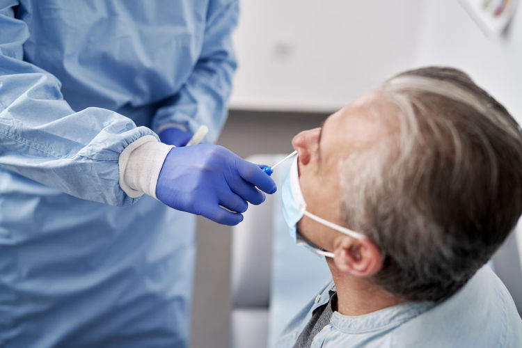 Close-up of doctor examining patient