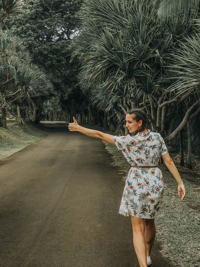 Hitch hiker girl on tropical islan