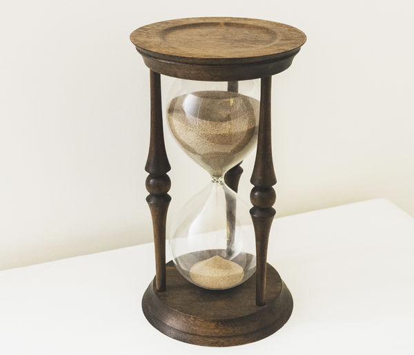 Close-up of hourglass on table 
