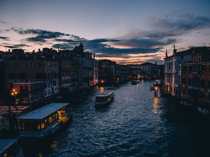 High angle view of boats on grand canal during sunset in city