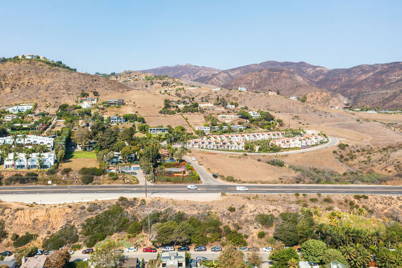 Santa monica hills in malibu with condominiums and homes. fire danger due to dry summer conditions.