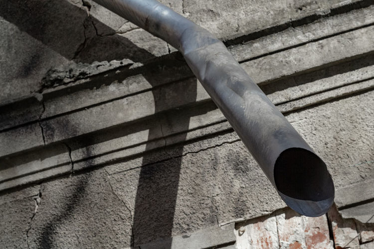 High angle view of metal pipe on wall