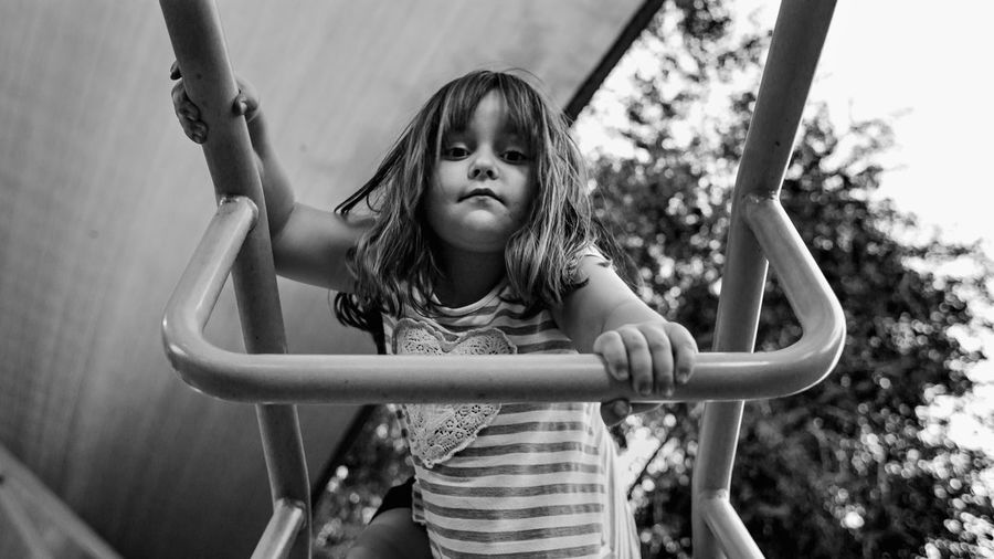 Portrait of girl on jungle gym