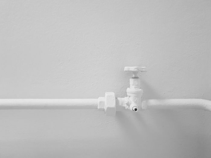 Close-up of pipe against wall