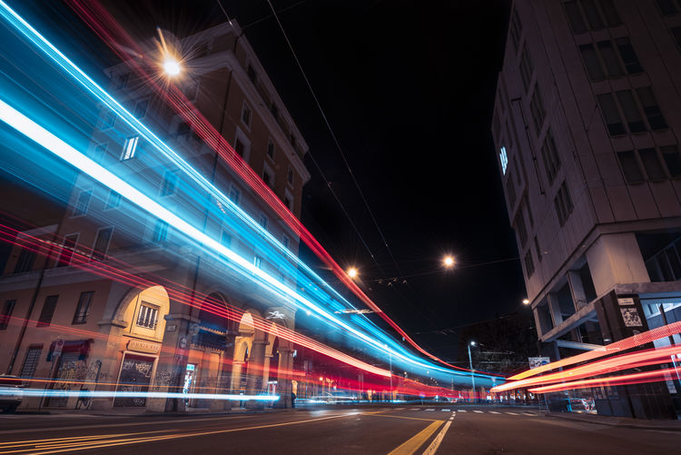 Light trails of pubblic transportation vehicle in the city at night. electric mood.