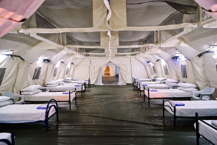Temporary covid field hospital set up inside an exhibition pavilion