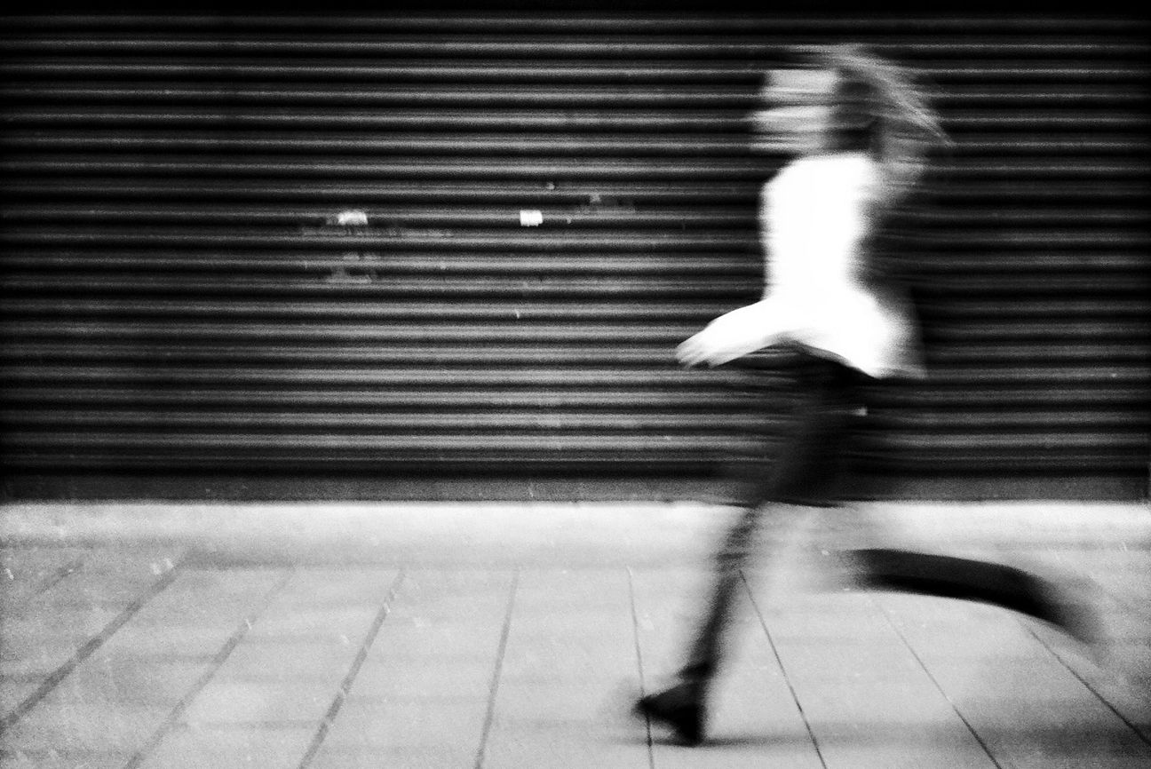 shadow, lifestyles, sunlight, night, full length, walking, leisure activity, motion, indoors, men, blurred motion, low section, person, flooring, tiled floor, silhouette, illuminated, high angle view