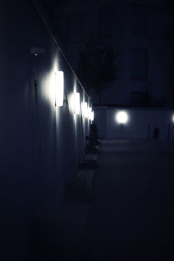 Illuminated street light in building at night