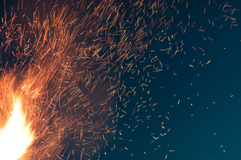 Close-up of sparks at night
