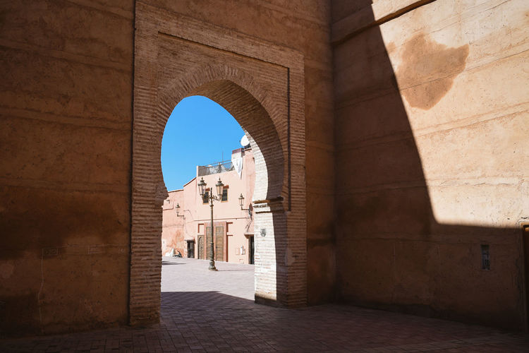 Archway of historic building against sky